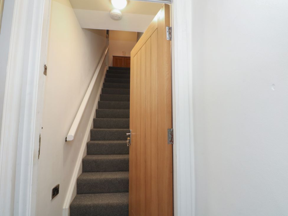 A staircase leading to an upper level at 32B Bank Street Rossendale