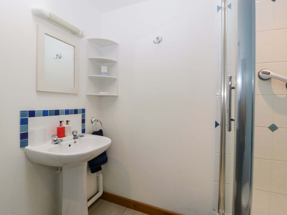 A bathroom featuring a sink and shower at Orchard Cottage in Corse near Gloucester