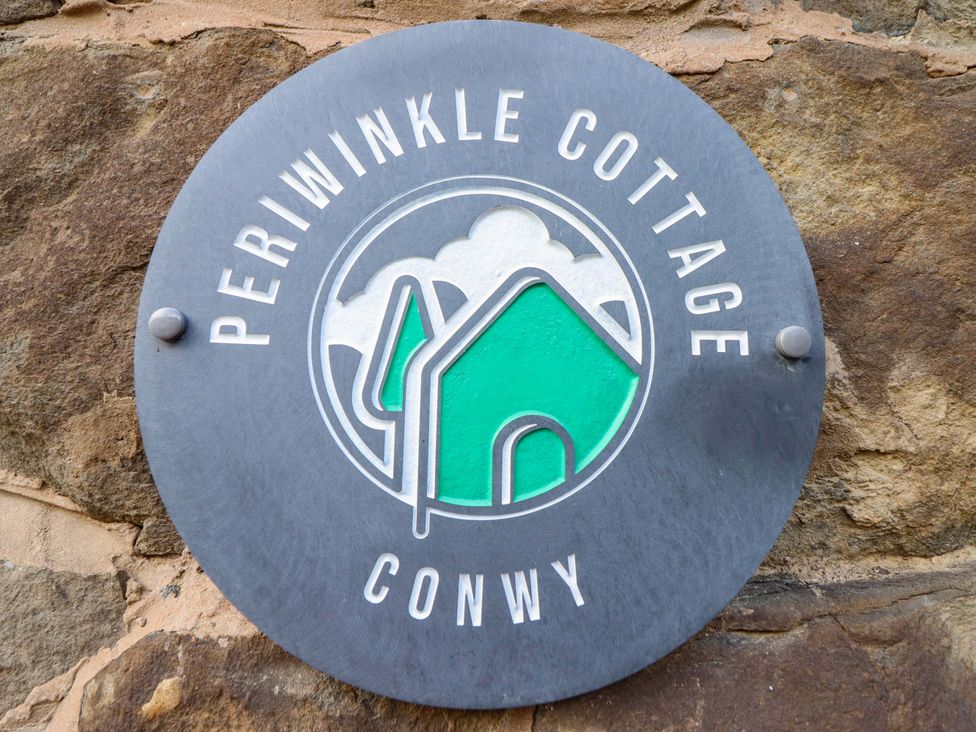 A sign for Periwinkle Cottage at Conwy