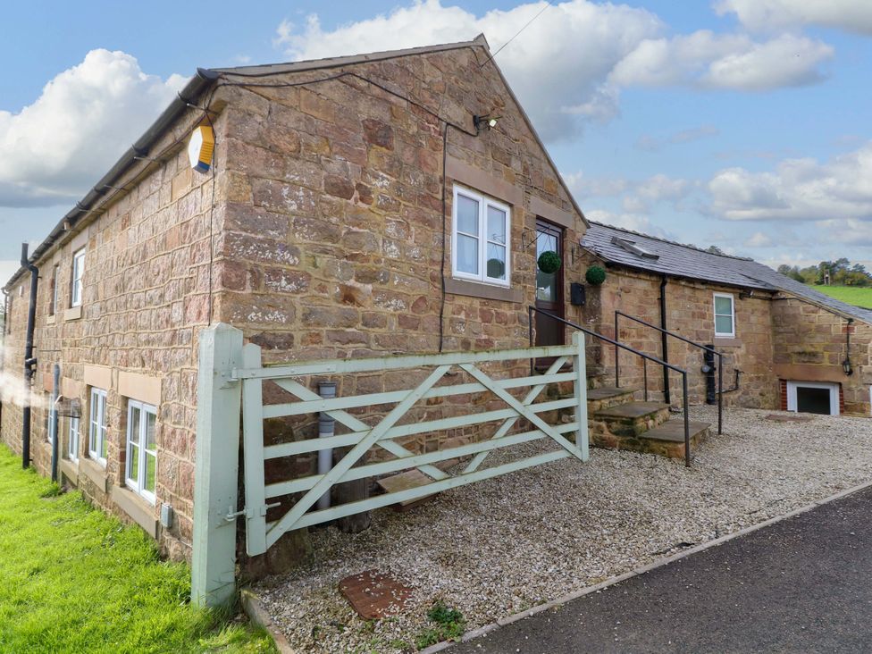 An exterior view of a stone house with a gate at The Annex in Belper