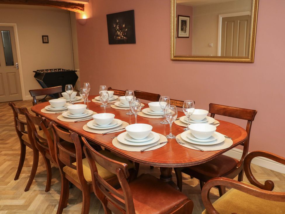 A dining room with a set table at The Annex in Belper