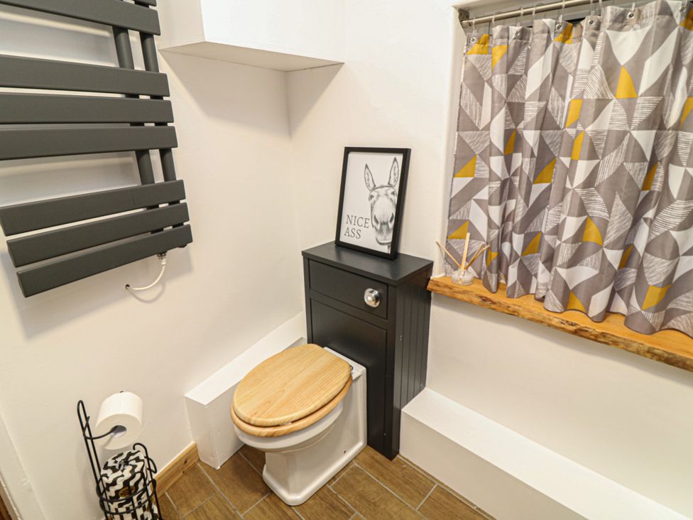 A bathroom with a toilet and radiator at 1 Nottingham Road Southwell