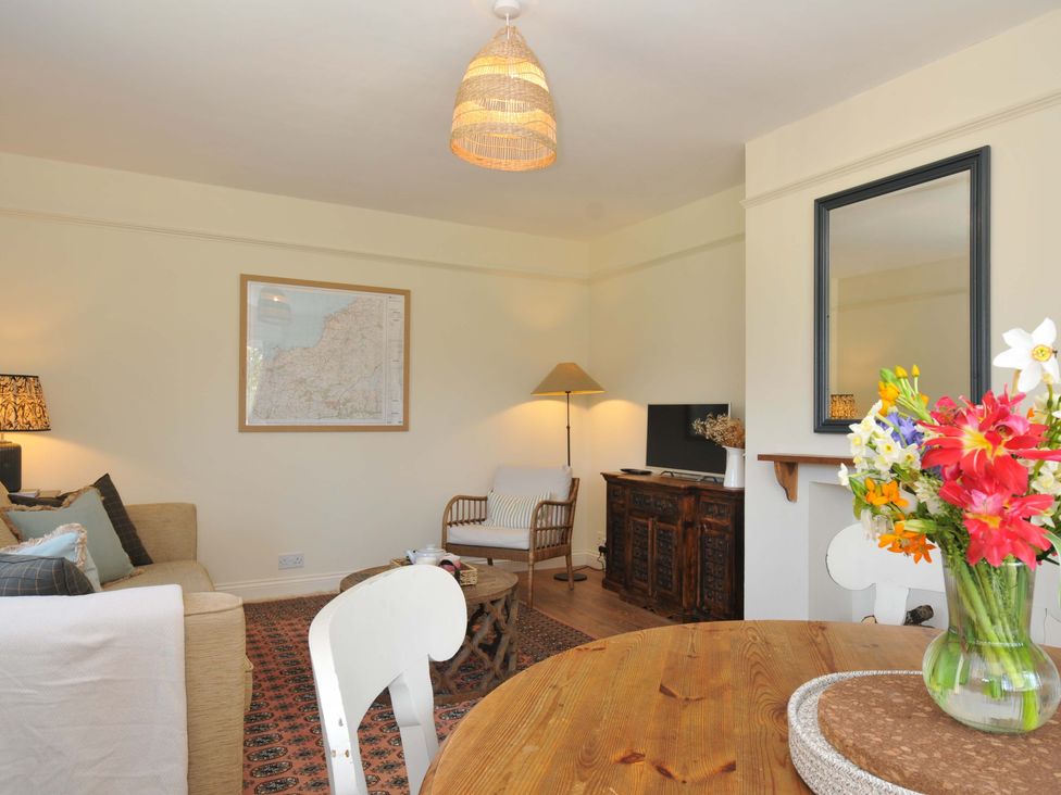 A living room with a sofa and coffee table at Copper Mine Cottage Trelill near Port Isaac