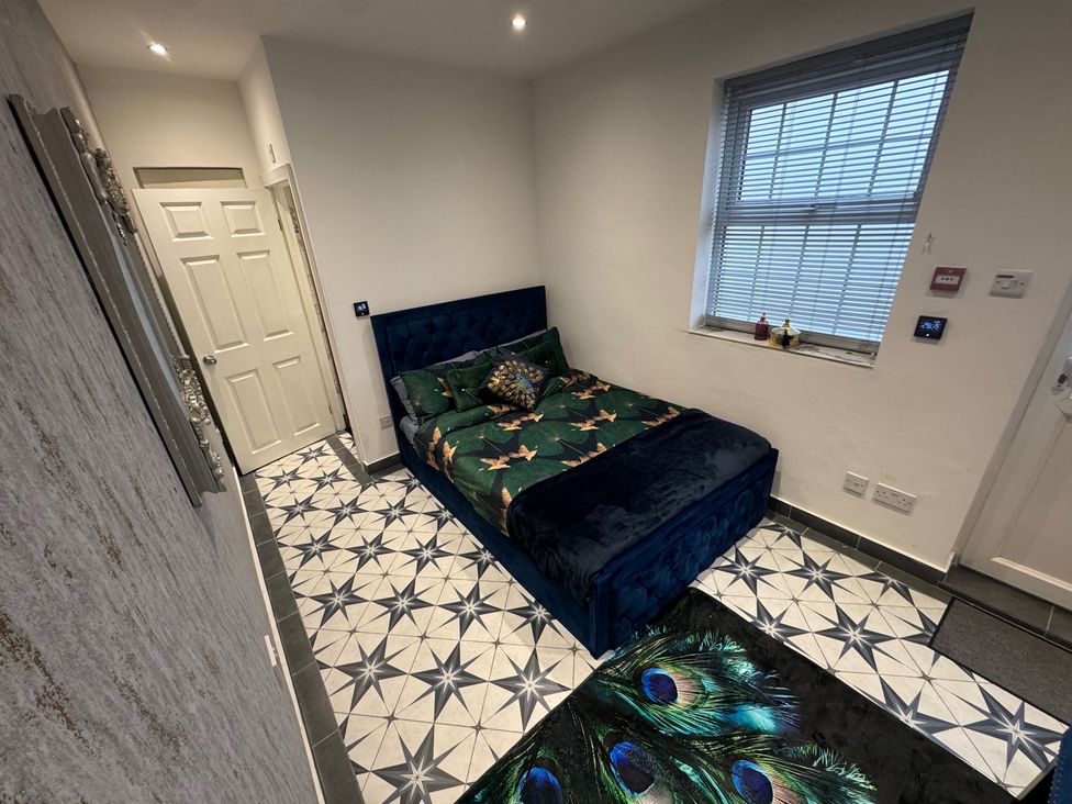 A bedroom with a bed and a window at 