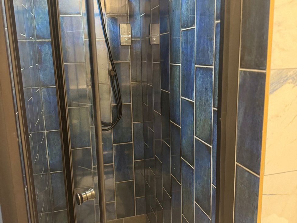 A shower with tiles in a bathroom