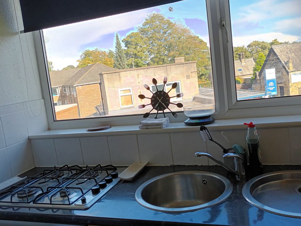 A kitchen with a window and sinks at 11 Kings Court