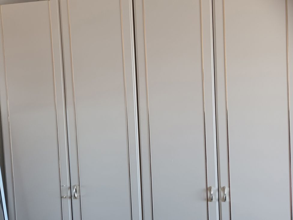 A wardrobe with multiple doors at 11 Kings Court