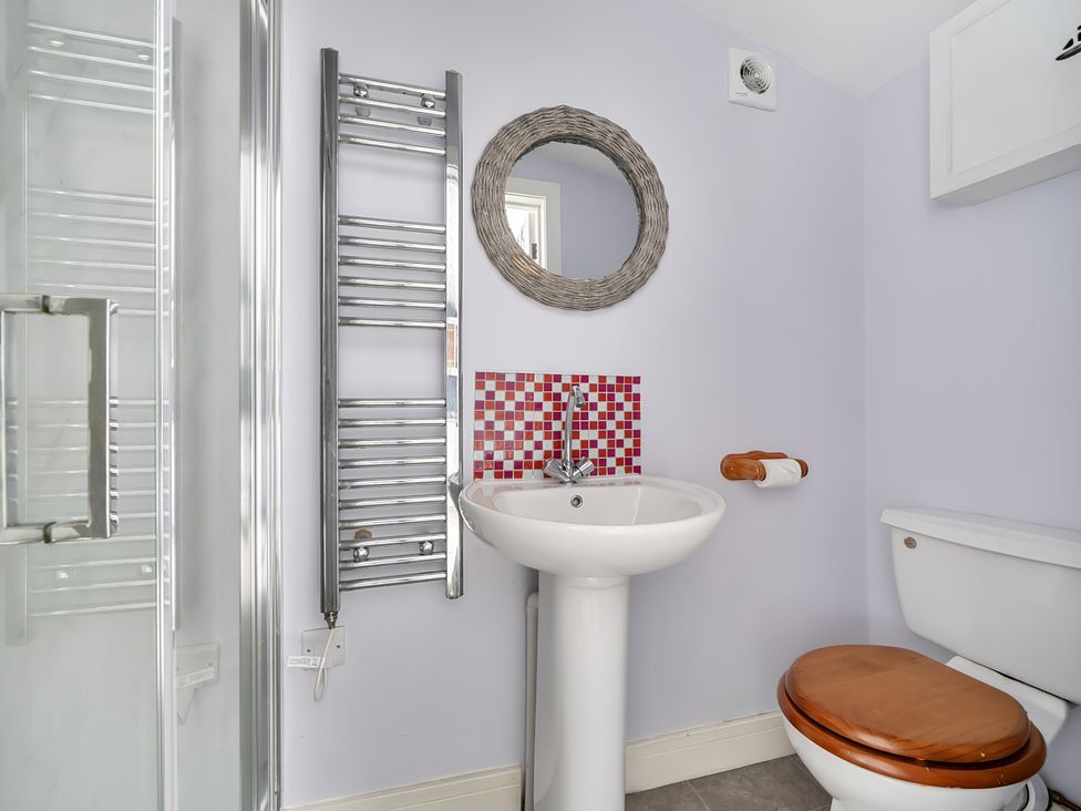 A bathroom with a sink and toilet at The Nook in Praa Sands