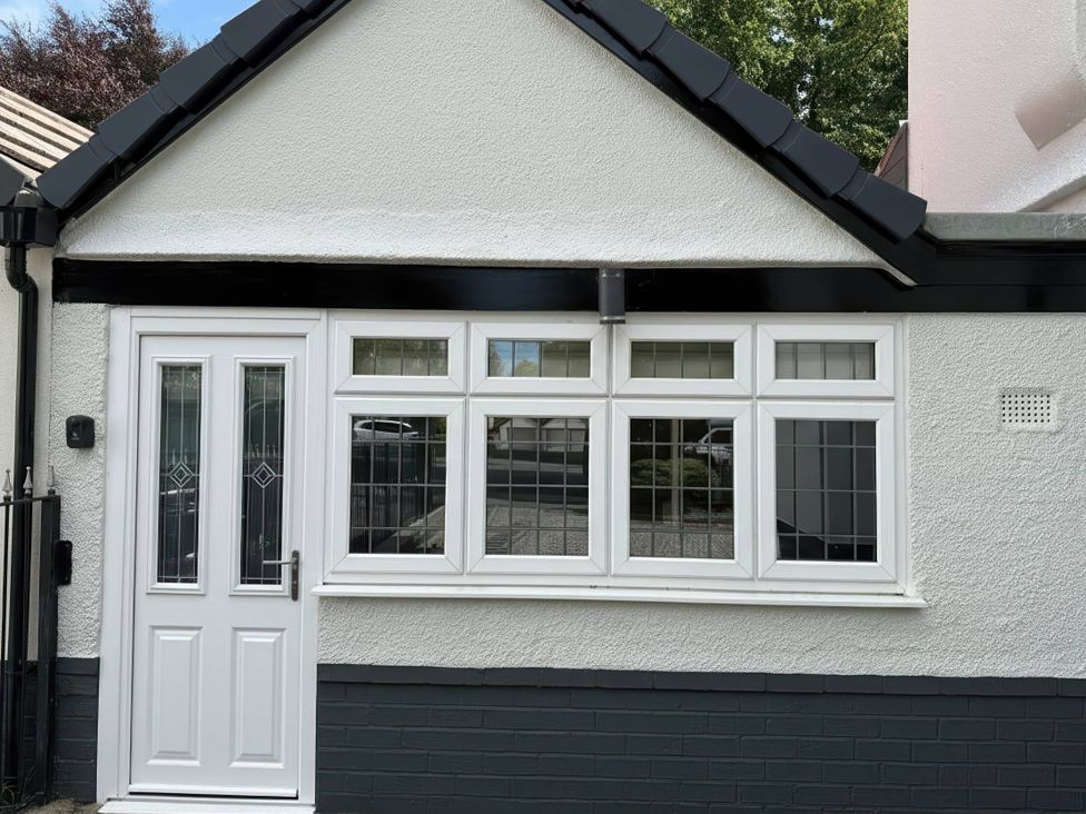 A front exterior view of a house at The Old Barn in Manchester