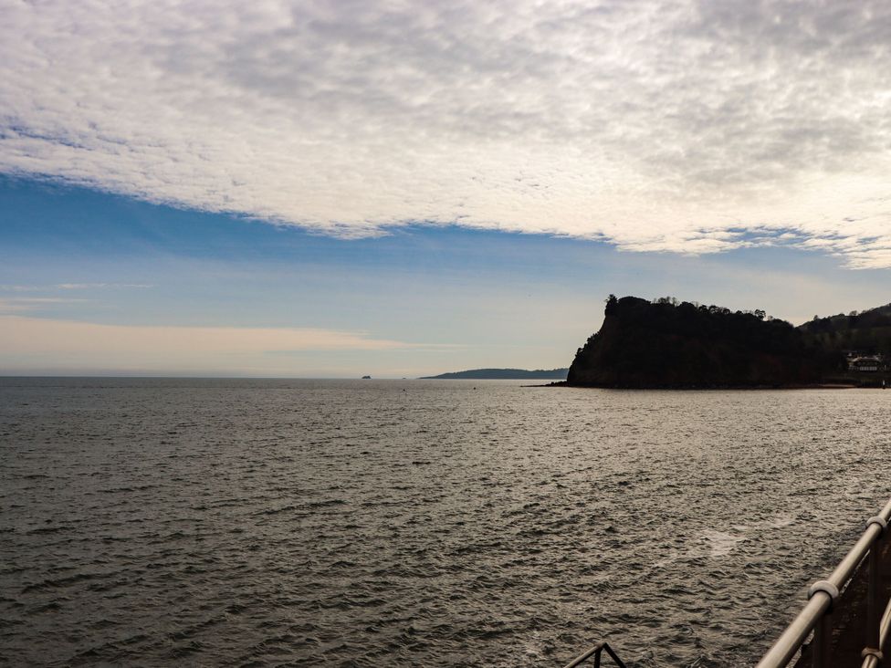 A view of the sea and cliff at Orchard Cottage in Dawlish