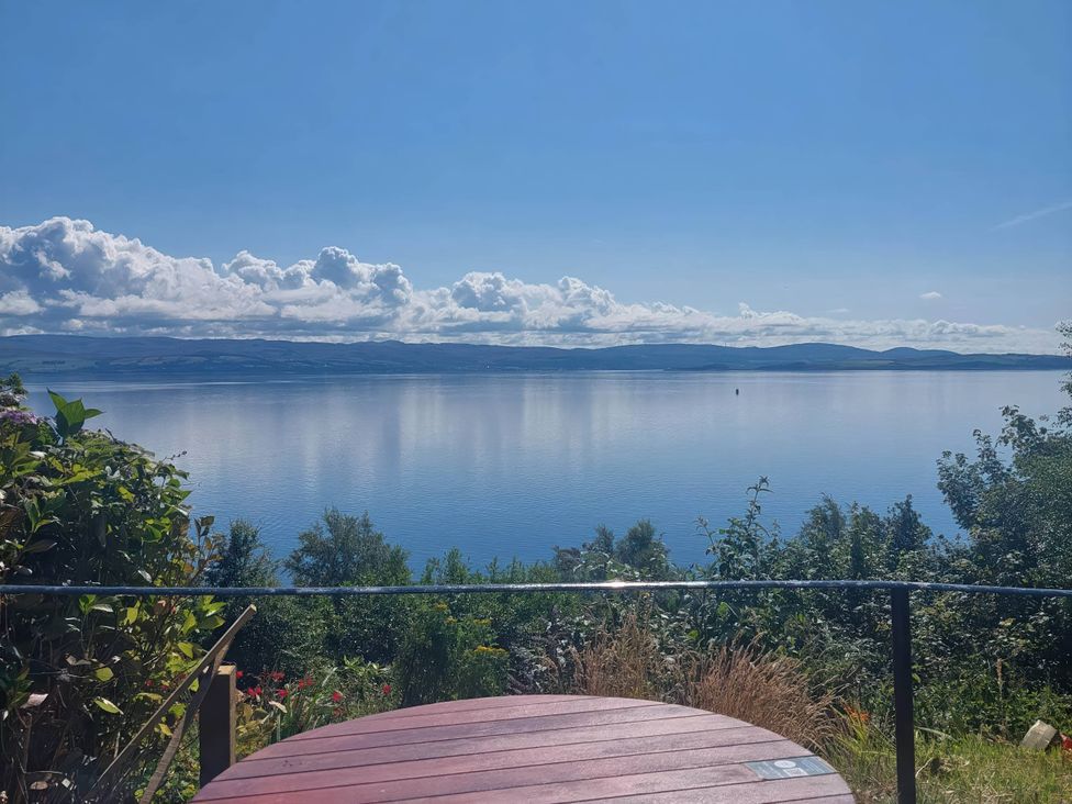 A view of a lake and sky with clouds at an outdoor location