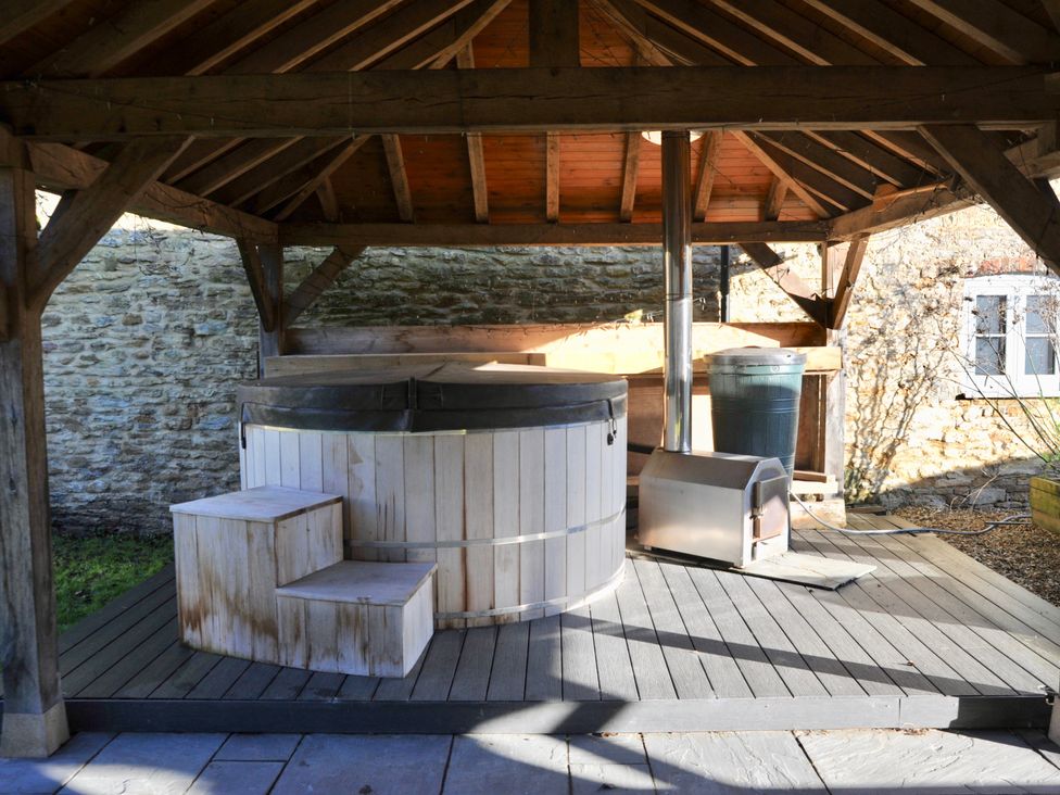 An outdoor area with a hot tub and steps at ASH HOUSE Wincanton