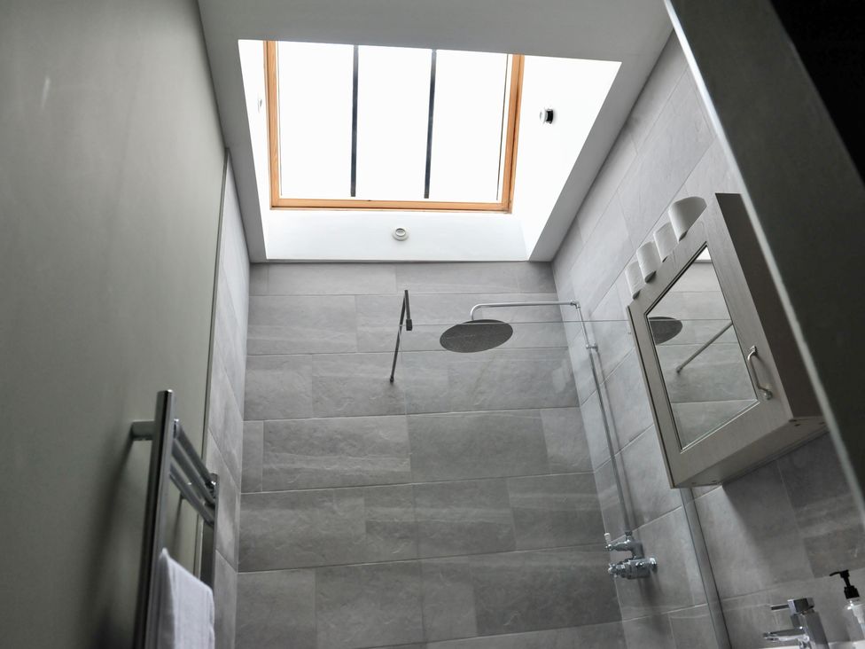 A bathroom with a shower and a window at ASH HOUSE in Wincanton