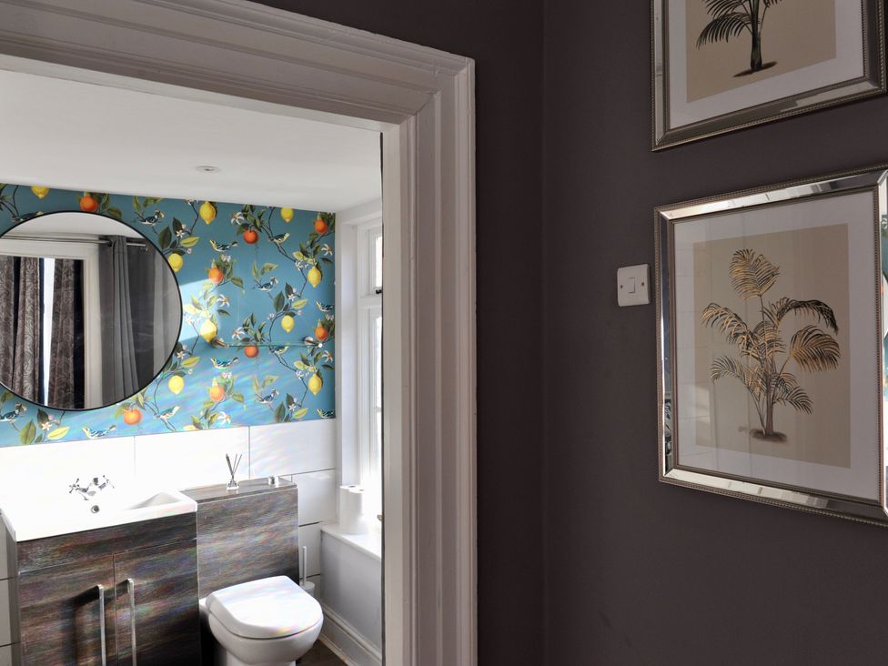 A bathroom featuring a toilet and wash basin at ASH HOUSE Wincanton
