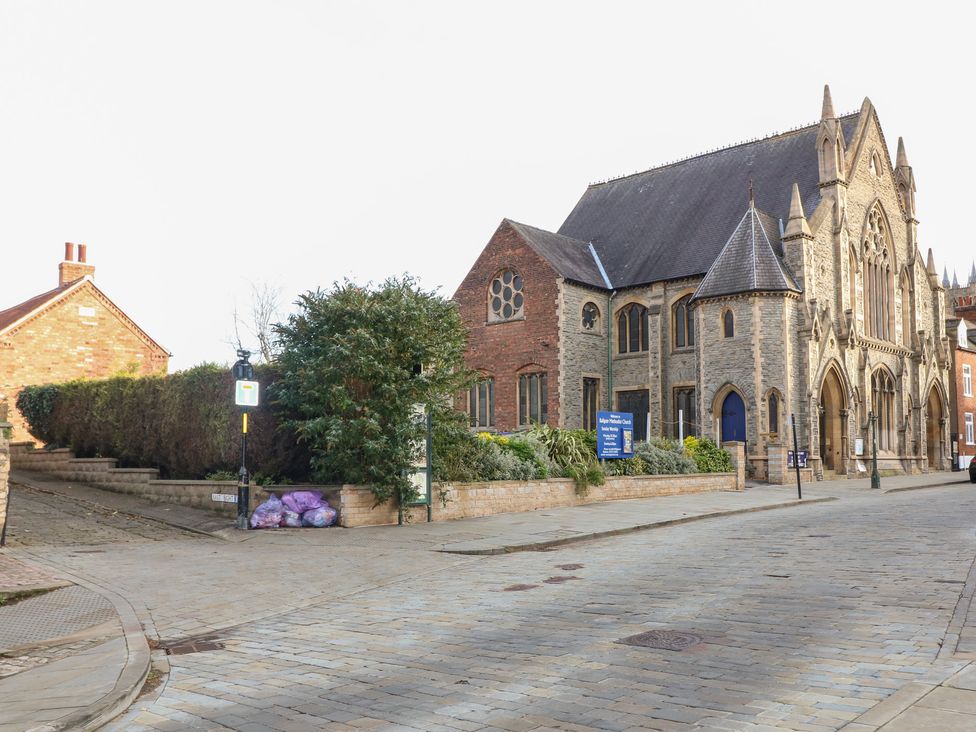A church building on a street with surrounding vegetation at Norbury House