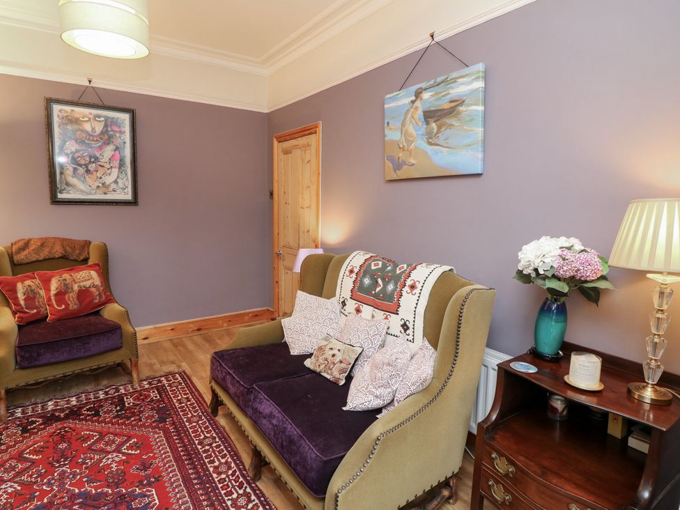 A living room with seating and artworks at Norbury House in Lincoln