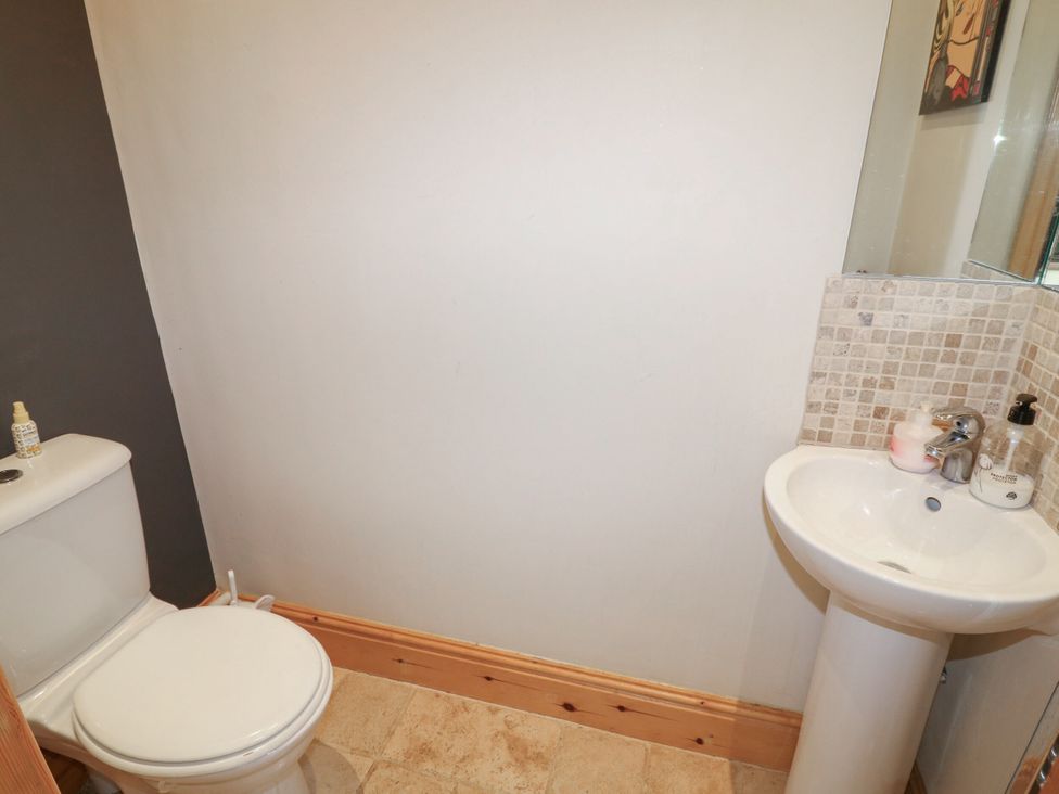 A bathroom with a toilet and sink at Norbury House Lincoln