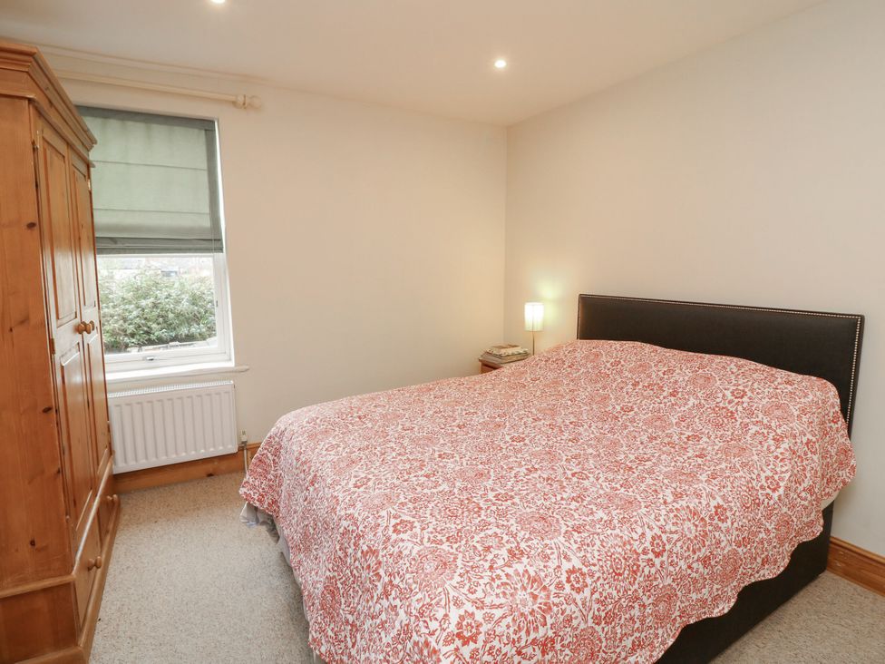 A bedroom with a bed and wardrobe at Norbury House in Lincoln