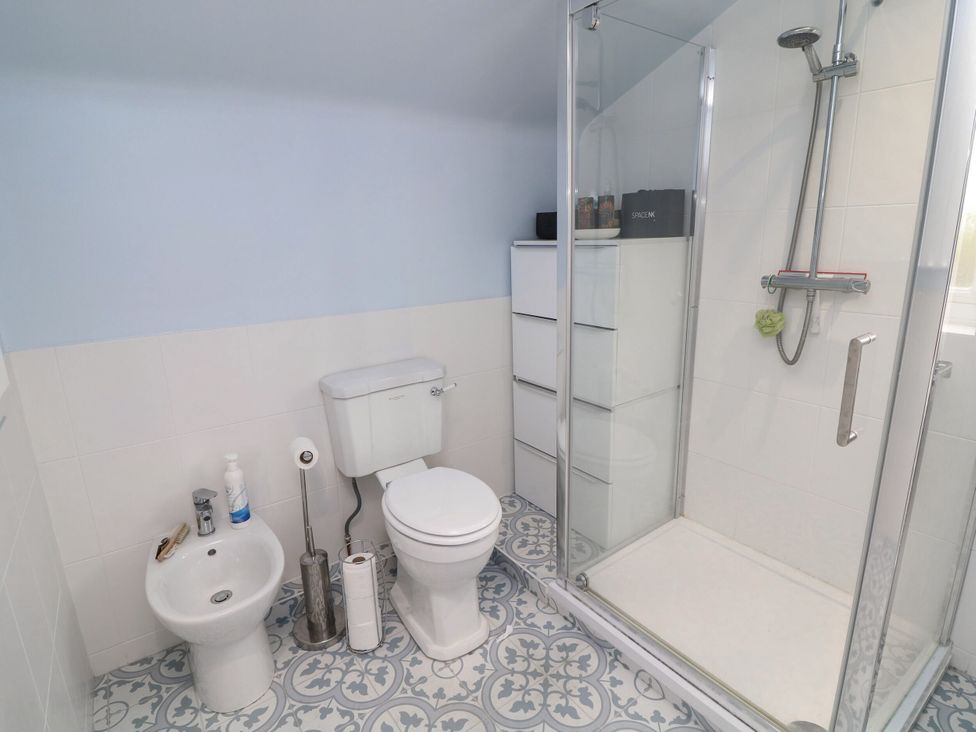 A bathroom with a shower and toilet at Norbury House Lincoln