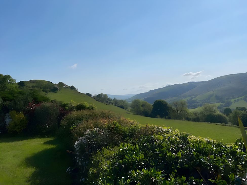 A view of hills and trees at Tranquil Cottage in 