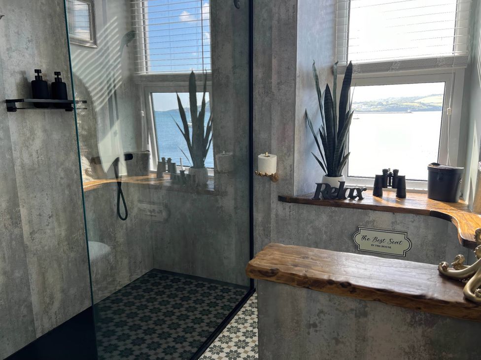 A bathroom with a shower and bathtub at The Best Seat in the House