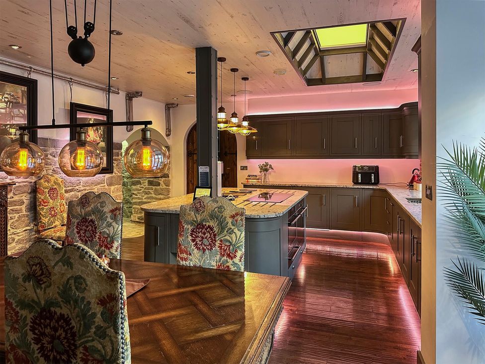 A kitchen with an island and dining area at the property