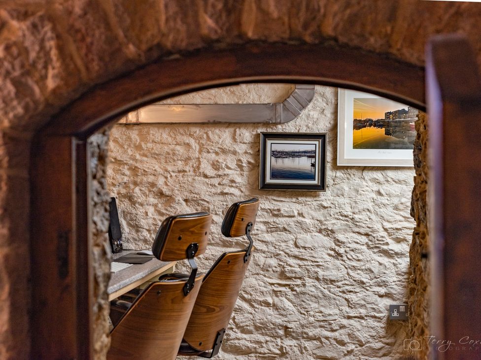 An office with chairs and artwork on the wall at The Old Barn in Manchester