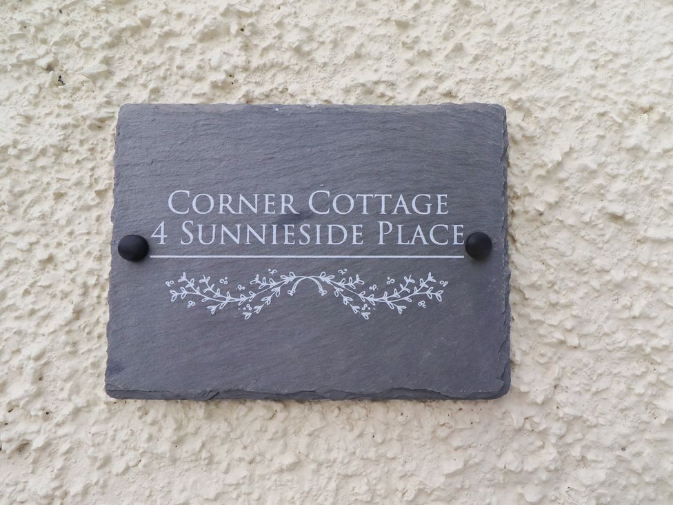 A nameplate for Corner Cottage at 4 Sunnyside Place