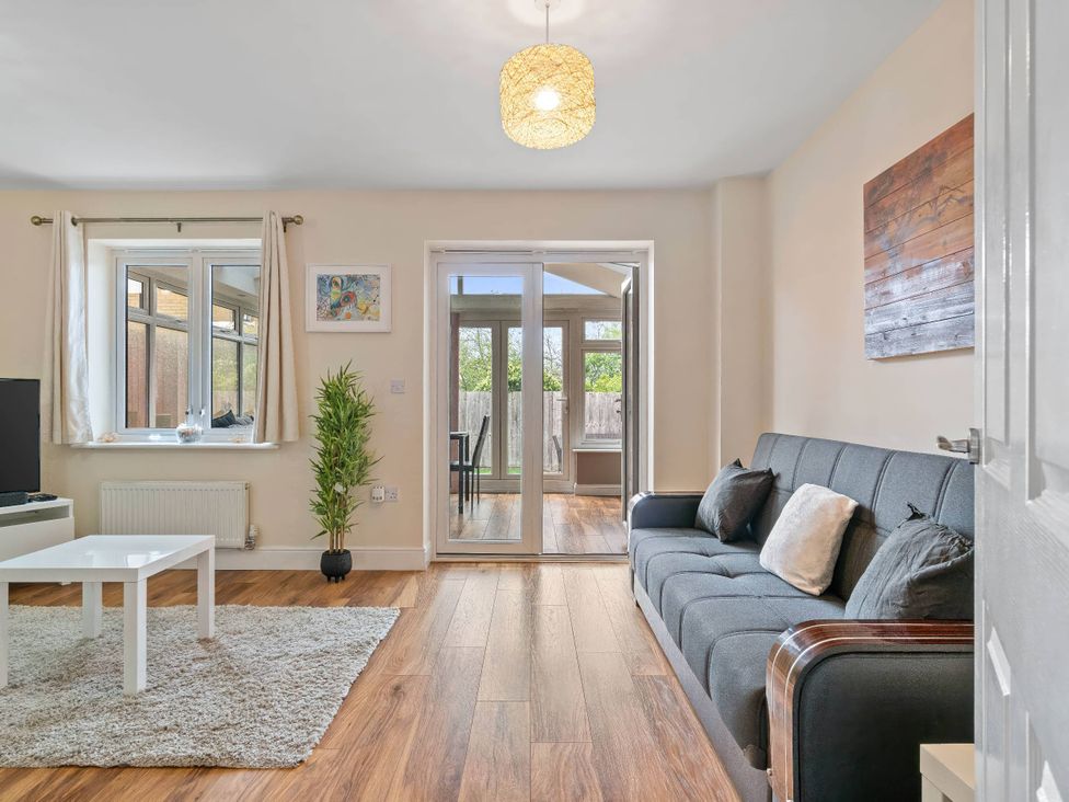 A living room with a sofa and coffee table at The Old Barn in Manchester