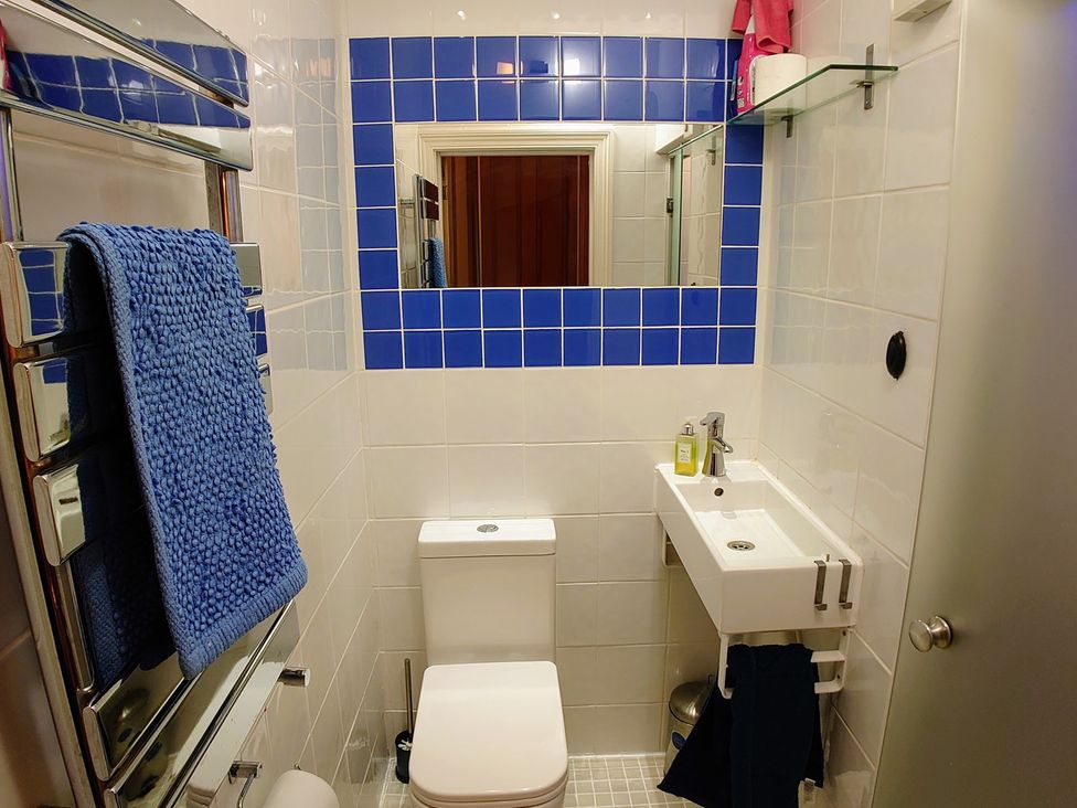 A bathroom with a toilet and sink at 55 Egerton Road