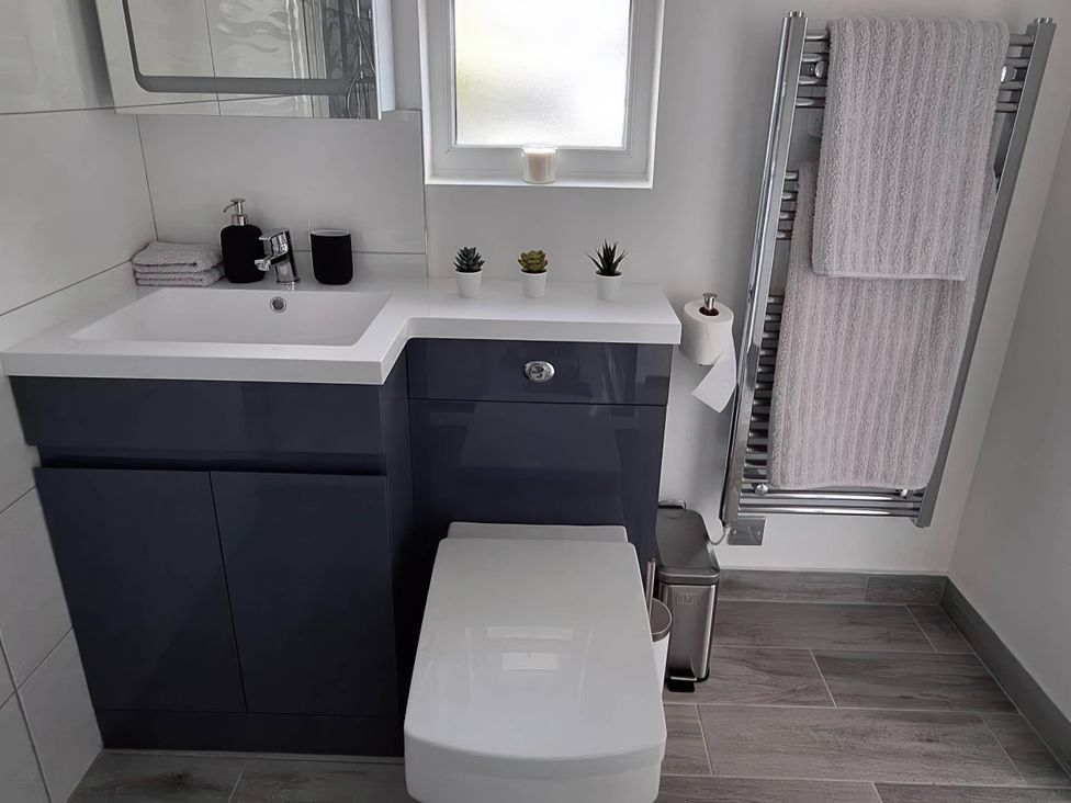 A bathroom featuring a sink and toilet at the property