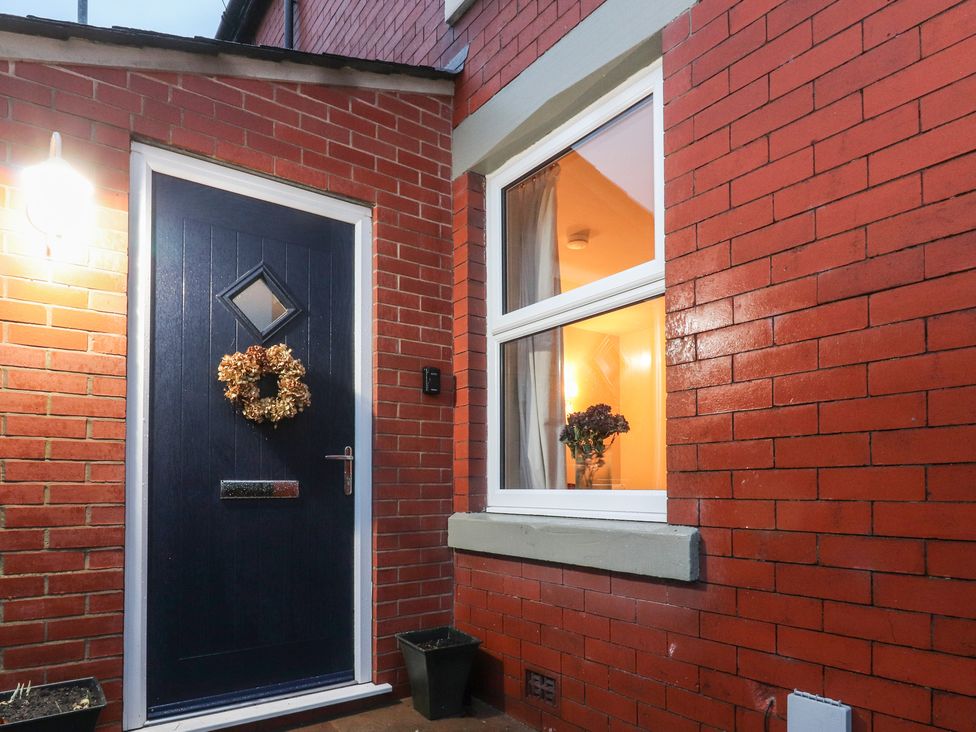An entrance with a door and window at Levenside in Preston