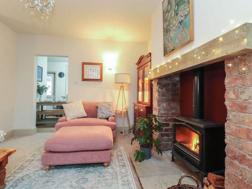 A living room with a sofa and fireplace at Levenside in Preston