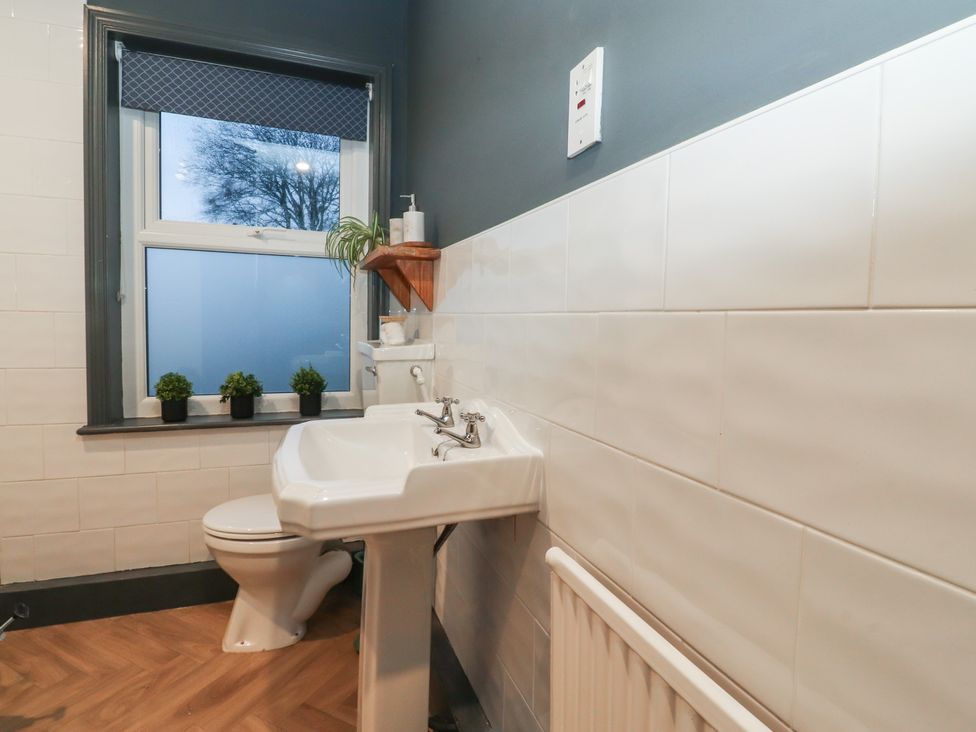 A bathroom with a sink and toilet at Levenside Preston