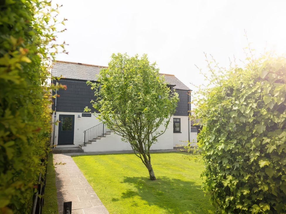 An outdoor area with a tree and steps at The Granary near St Merryn