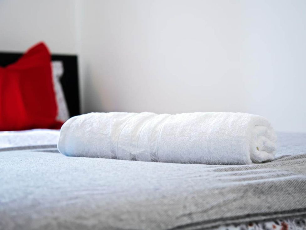 A towel on a bed at a property