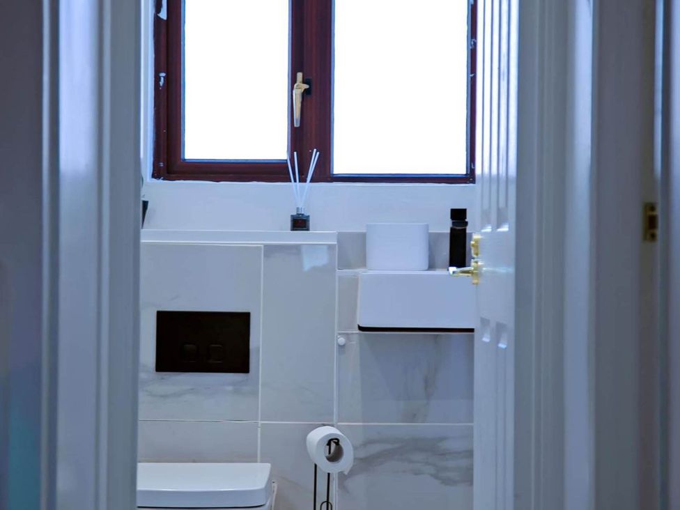 A bathroom with a sink and toilet at The Old Barn in Manchester