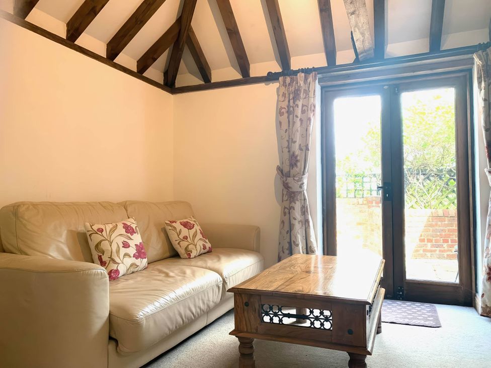 A living room with a sofa and a coffee table at the property in the location