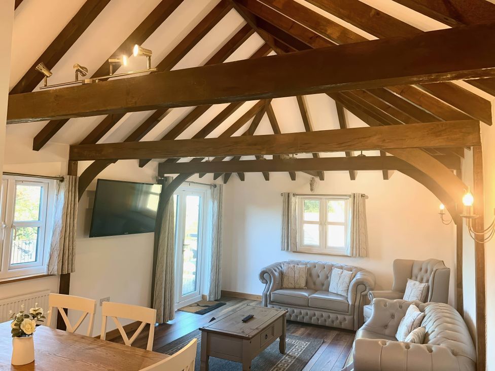 A living room with a sofa and coffee table at The Old Barn in Manchester