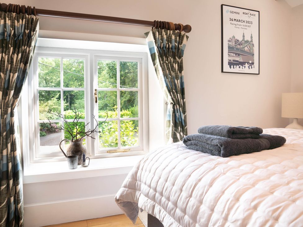 A bedroom with a bed and a window at 