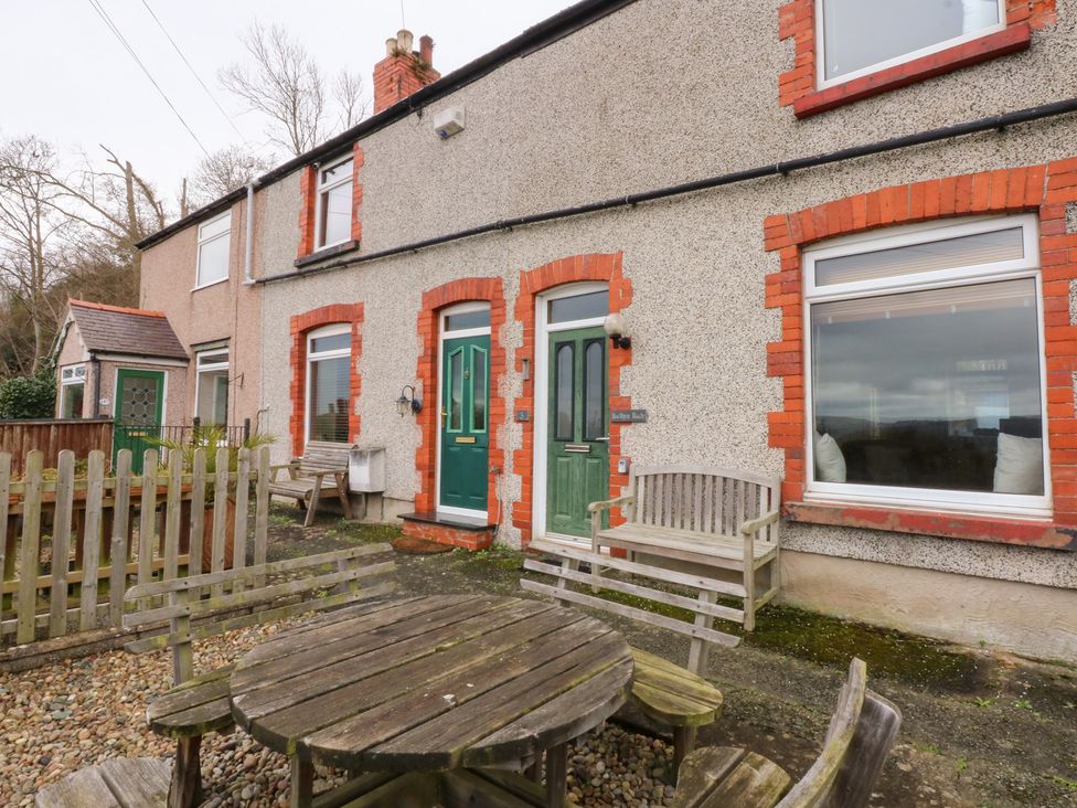 A house with a garden and seating area at 3 Bay View Terrace in Llandegfan