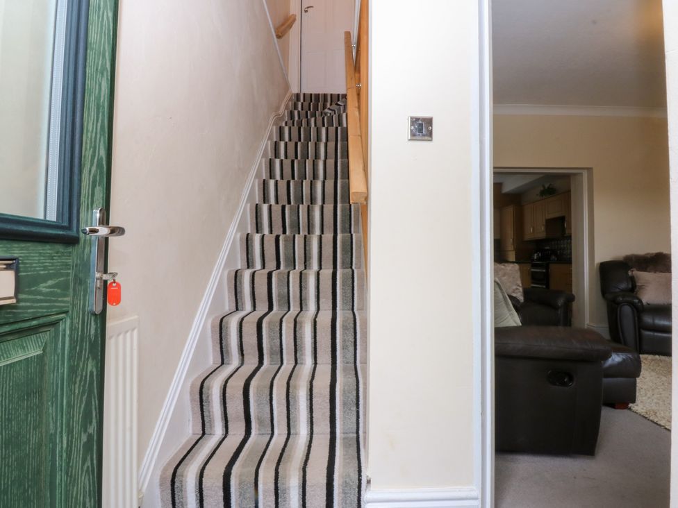A staircase in a hallway at 3 Bay View Terrace Llandegfan