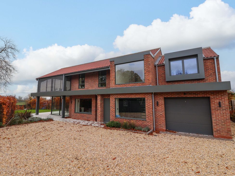 A house with a garage and multiple windows at Woldside in York