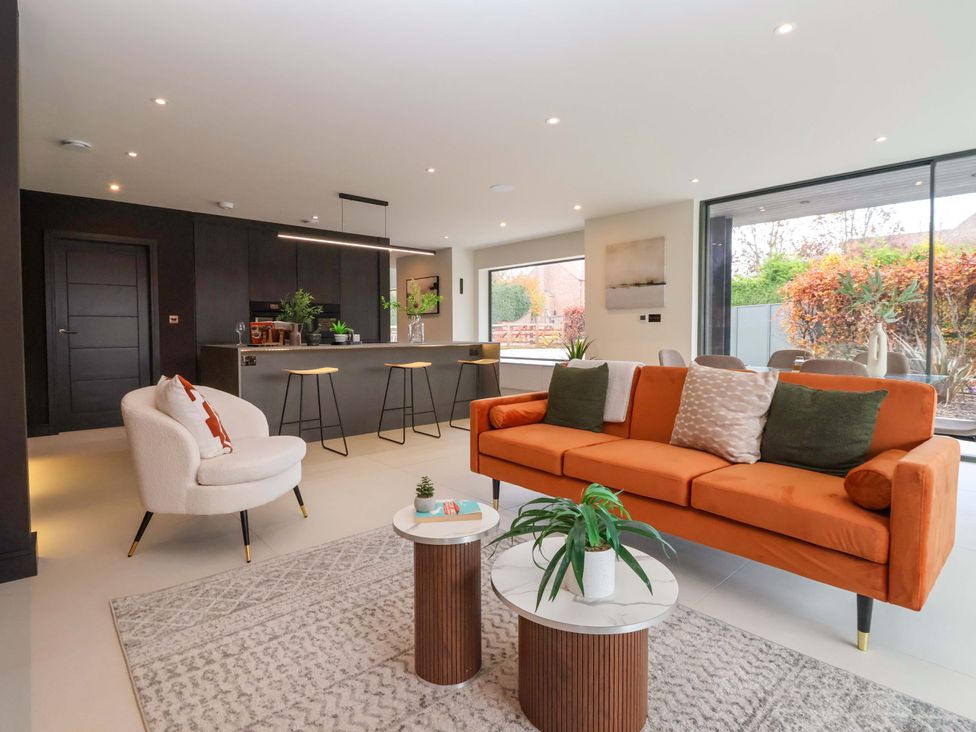 A living room with a sofa and armchair at Woldside in York