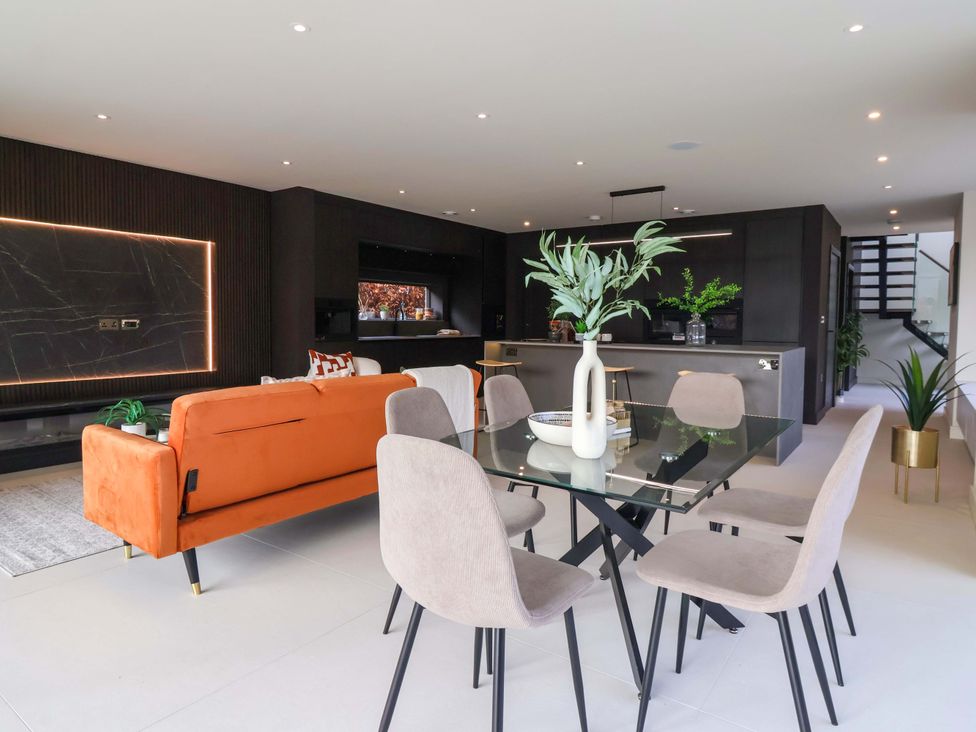 A dining area with a table and chairs at Woldside in York