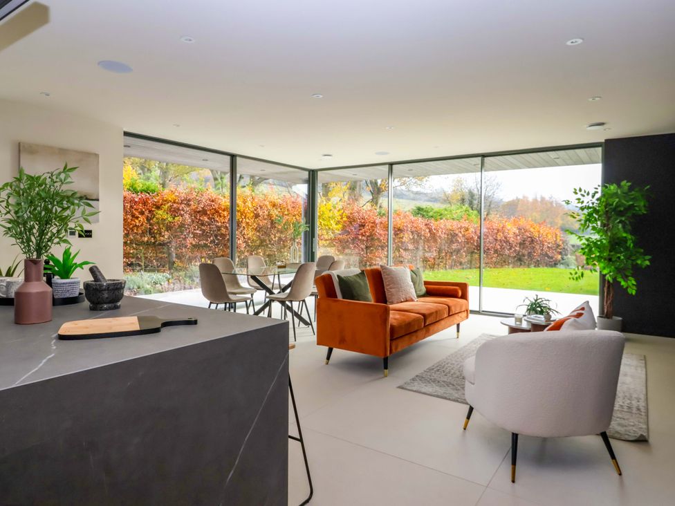 A living room with a sofa and chairs at Woldside in York
