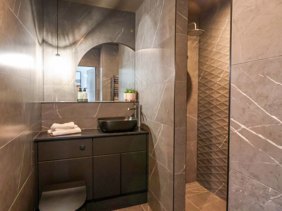 A bathroom with a sink and shower at Woldside in York
