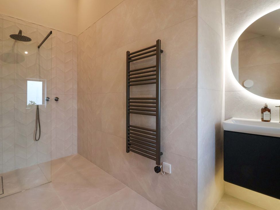 A bathroom with a shower and sink at Woldside in York