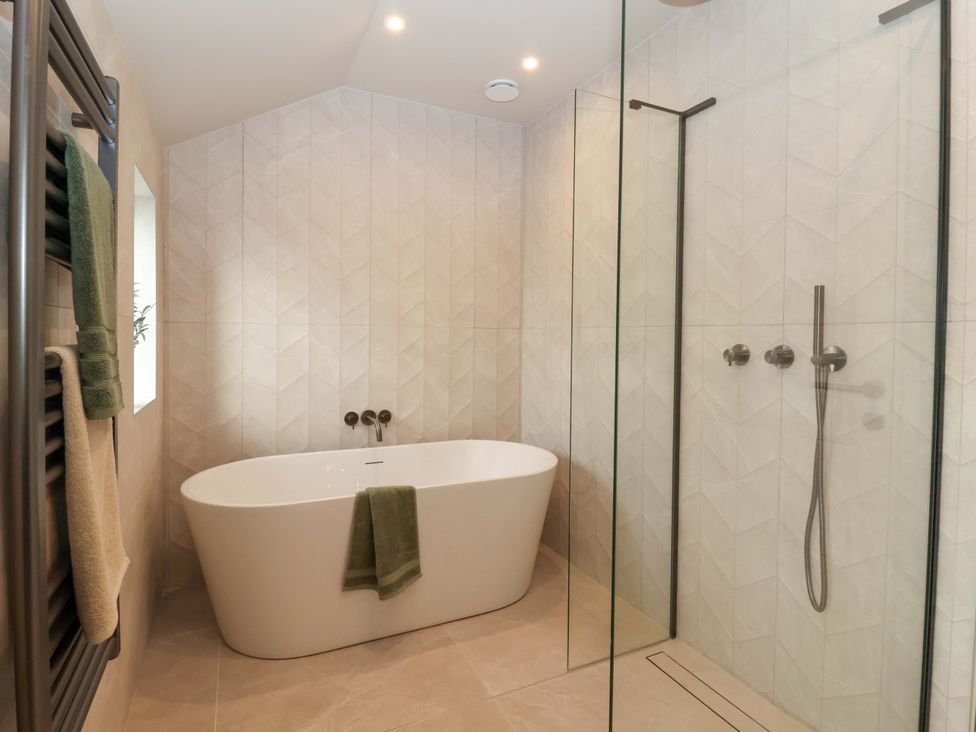 A bathroom with a bathtub and shower at Woldside in York