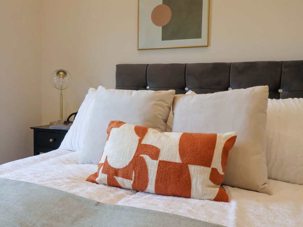 A bedroom with a bed and pillows at Woldside in York